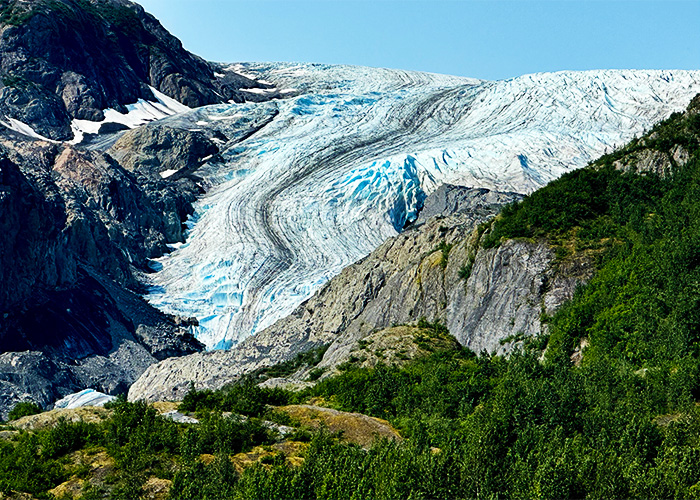 Hiking at Exit Glacier provides access to witness the rapidly receding ice on trails ranging from a paved loop to the strenuous Harding Icefield Trail. Hiking at Exit Glacier provides access to witness the rapidly receding ice on trails ranging from a paved loop to the strenuous Harding Icefield Trail.
